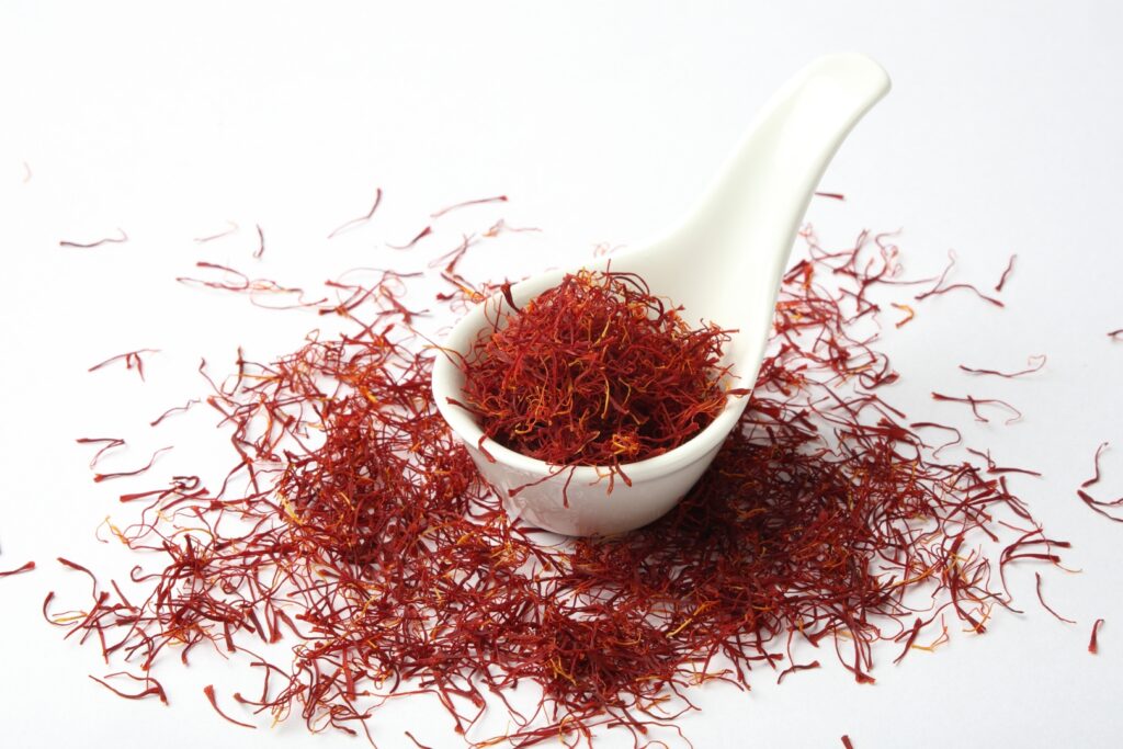 Saffron spices threads in white spoon, Credit- shutterstock_2405461767ction=e