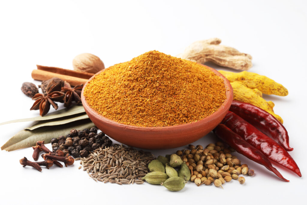 Curry Masala Powder with ingredients. Image Via Shutterstock